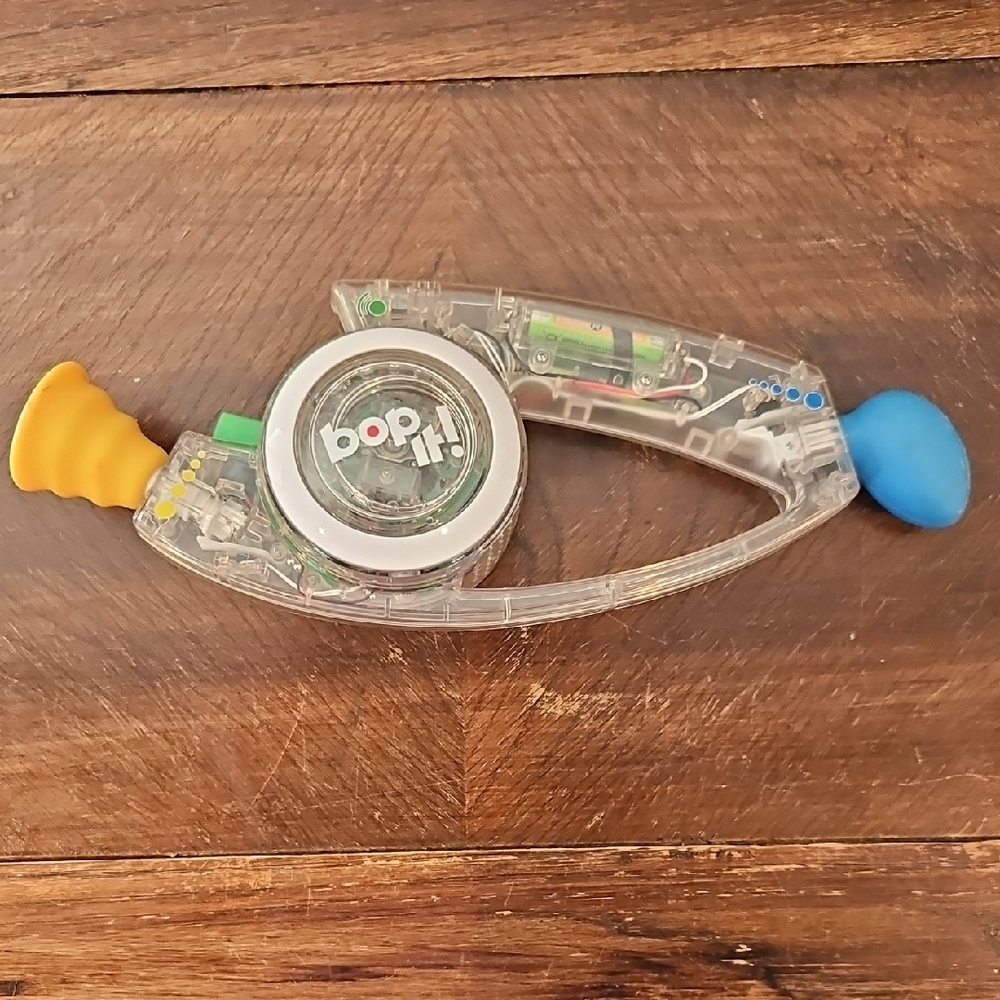 Vintage RARE Bop It! Clear Handheld Electronic Game with Yellow & Blue Ends